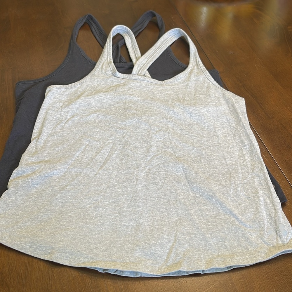 Under Armour tanks, gray and black, small. Heat Gear.